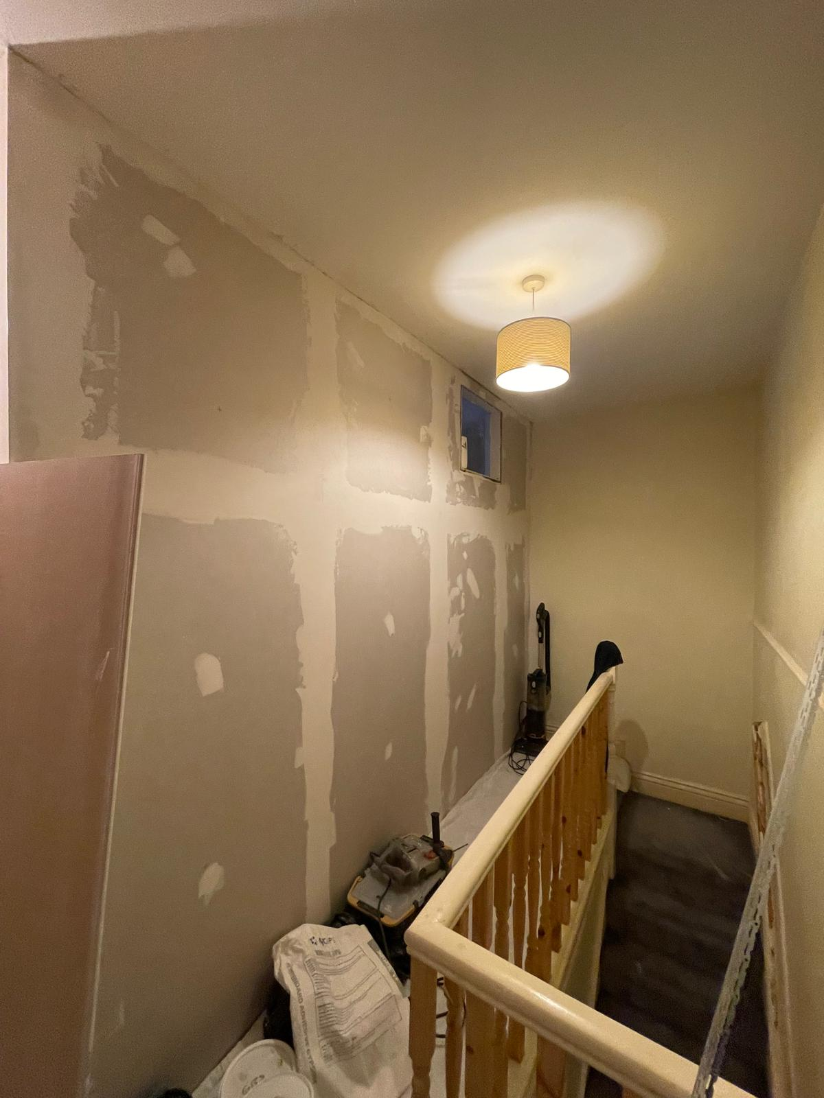 Upstairs landing during plaster preparation before final decoration