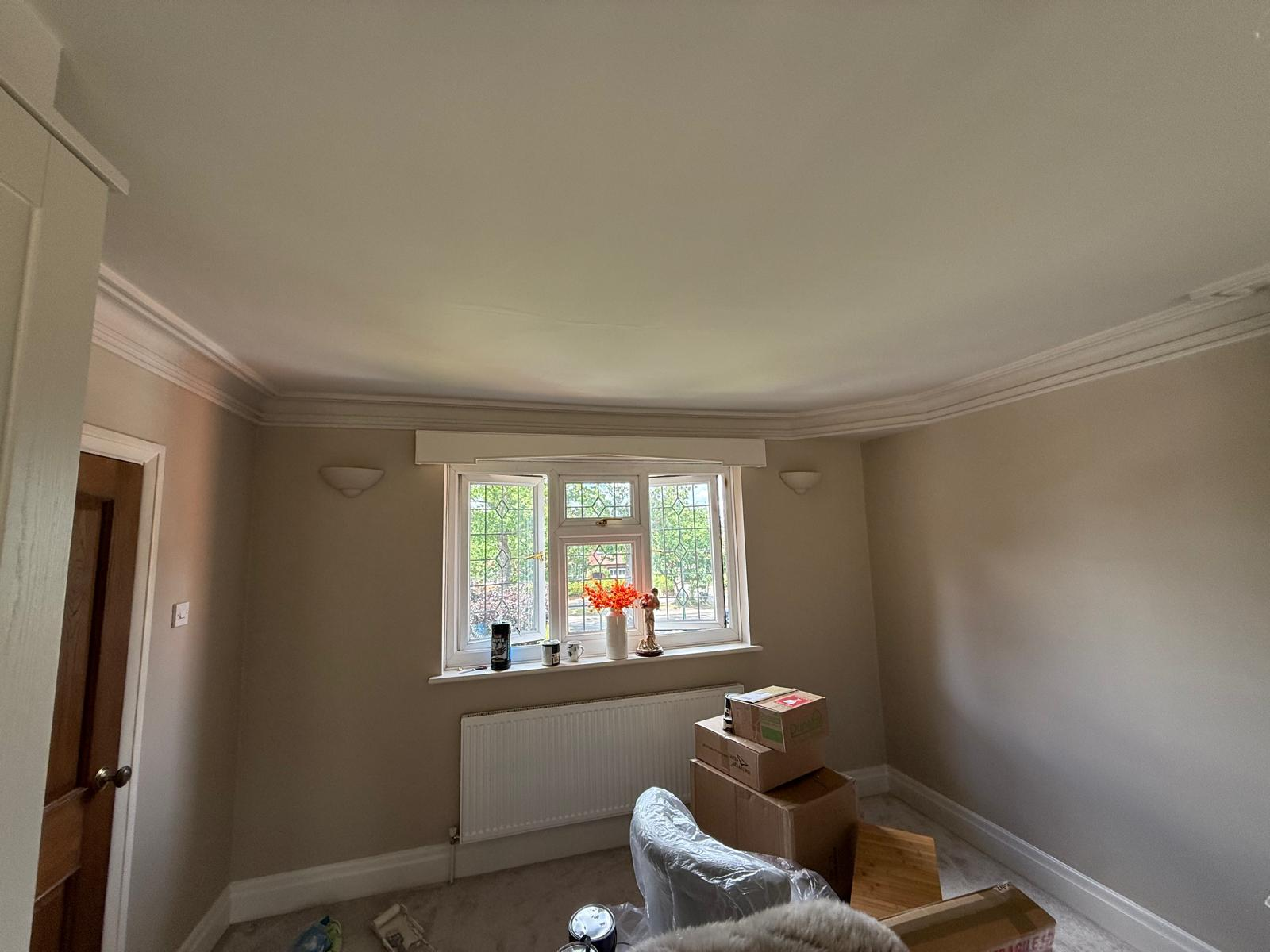 Completed study with refined coving, neutral walls and leaded bay window