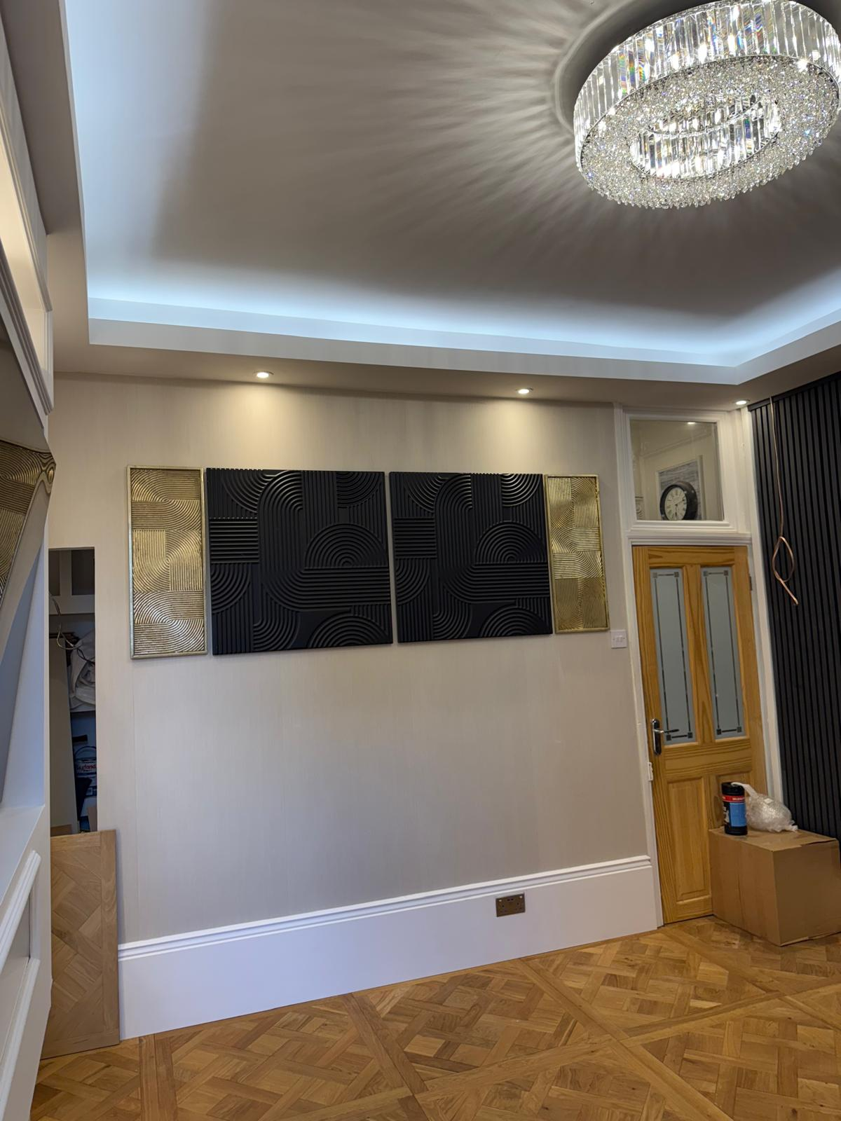 Detailed view of decorative wall art, crystal chandelier and finished timber floor